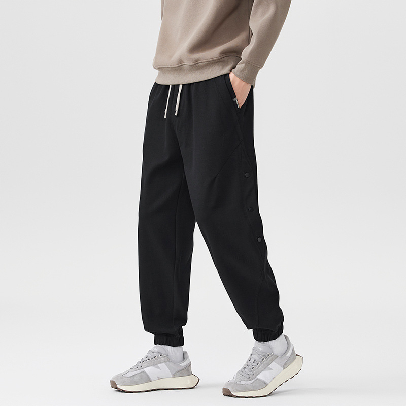 Pantalones casuales pesados negros para hombres sueltos 2025, nuevo otoño y invierno, pantalones deportivos gruesos con marca de algodón colgante