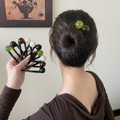 震え音の気質の団子の頭はヘアピンの頭を巻いて女性のシンプルなファッションのレトロな髪飾りに出かけます。