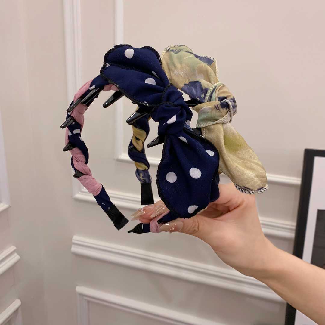 A navy blue polka dot + an ink yellow contrasting rabbit ear comb headband