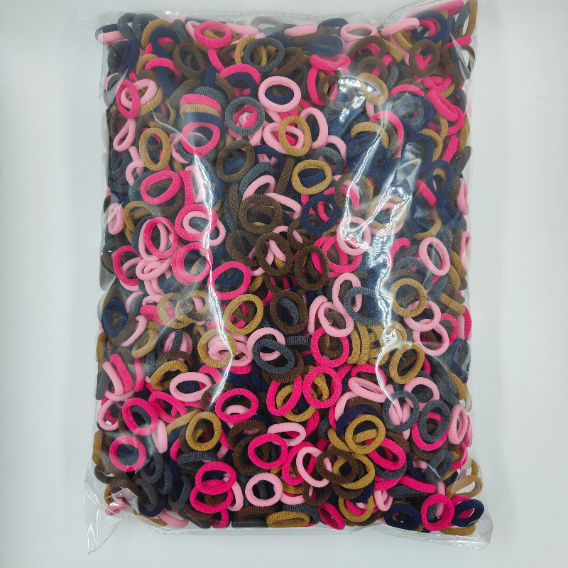 Fábrica directa sin costuras de alta elasticidad cuerda de cabeza para niños anillo de toallas OPP2000 anillo de cabello de cabello para bebés al por mayor