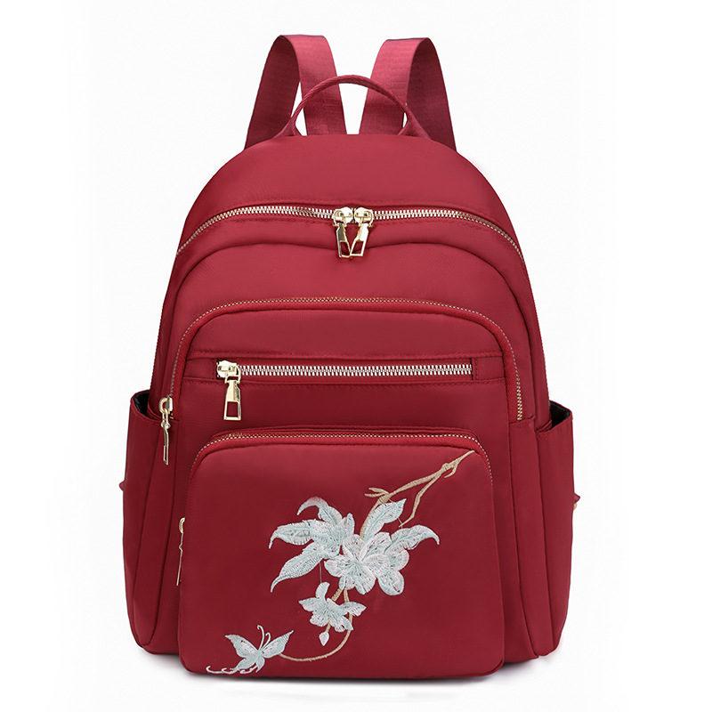 Mochila bordada para mujer 2024 nuevo estilo salvaje para mujer mochila de viaje ligero de viaje de gran capacidad de moda