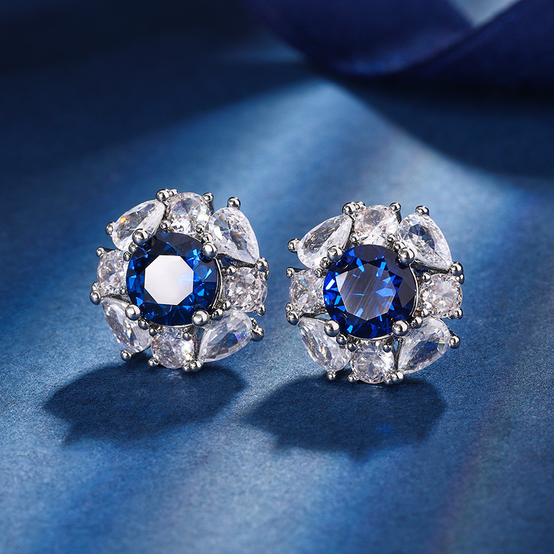 Otoño e Invierno nuevo estilo Zhuang Sheng joyería cobre fondo chapado en oro simulación azul punta cristal redondo temperamento luz lujo traje femenino 10mm7m