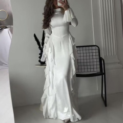 欧米の外国貿易の婦人服は越境して秋の丸首のラッパの袖のセクシーな気質の高い腰のつなぎ合わせて明らかにやせているレースのワンピースを現します。