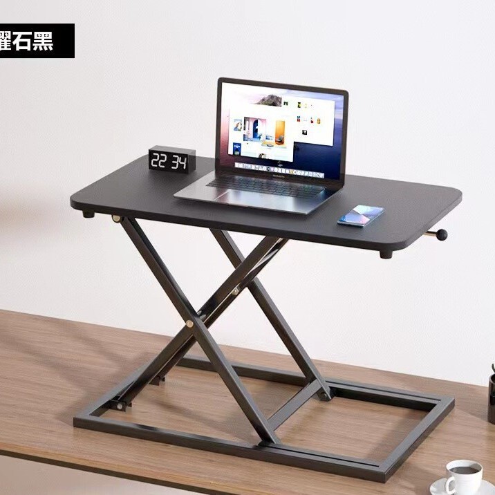 立っているデスクの昇降コンピュータの机の折り畳みの机の上で気動のタイプのデスクトップはノートの小さいテーブルを高く上げます。|undefined