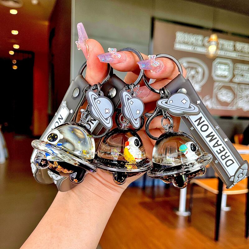 Creative Personality black gold astronaut spacecraft oil keychain cartoon floating spaceman pendant small gift