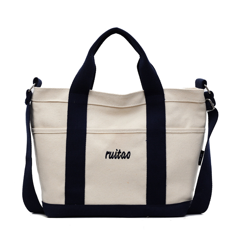 Bolso Tote de moda coreana 2025 verano nuevo estilo bolso de hombro estilo universitario bolso de mensajero de lona de color de contraste mujer