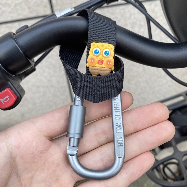 Gancho para coche eléctrico, pastel de esponja de dibujos animados, gancho para colgar multifuncional frontal, soporte de carga de aleación de aluminio, instalación gratuita