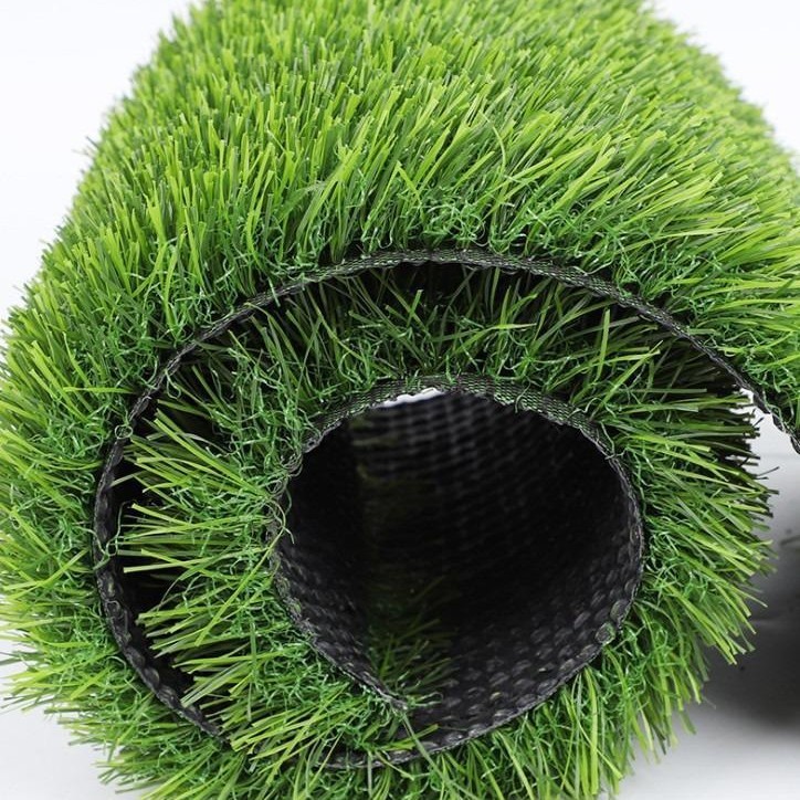 芝生のじゅうたんの人造偽の芝生の野外サッカー場の幼稚園の敷物の人工プラスチックの草の緑の囲いをシミュレーションします。|undefined