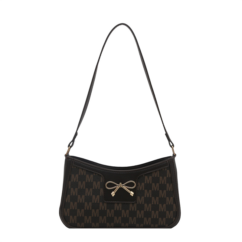 Cosmetía coreana estilo de moda textura arco de moda primavera 2025 nuevo estilo extranjero de viaje brazo bolso de hombro para mujeres