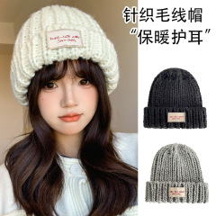布の大きい帽子を貼って、子供の秋冬は暖かくて耳のニットの帽子を保護します。