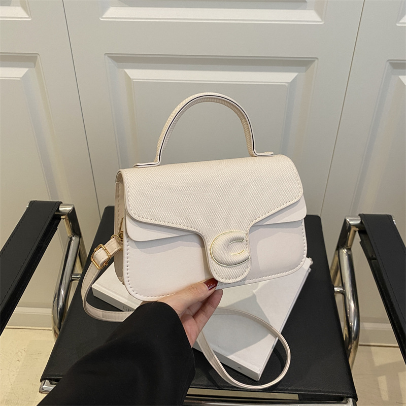 Trendy de verano 2025 nuevo bolso cuadrado pequeño de color en contraste bolso de moda bolso diagonal portátil de textura occidental de todo fósforo para mujer