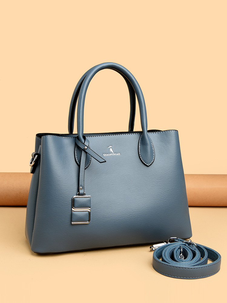 Nuevo bolso de mujer simple de moda, bolso de mano de cuero suave de gran capacidad, bolso de tela de mujer, bolso de canguro