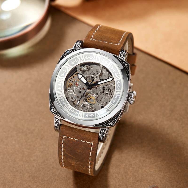Nuevo reloj transfronterizo en vivo de los hombres de cuero genuino estilo nacional diseño hueco en relieve tallado impermeable luminoso reloj mecánico hombres