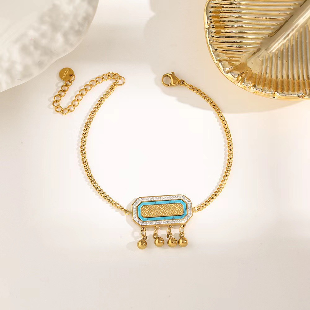 Pulsera de trébol de acero titanium vendedora caliente transfronteriza europea y americana con incrustaciones de concha pulsera colgante pulsera de diseño avanzado sin desvanecimiento al por mayor