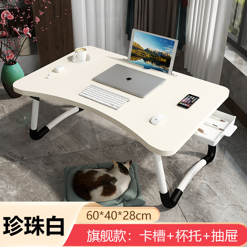 ノートパソコンの机の上で折り畳みます。|undefined