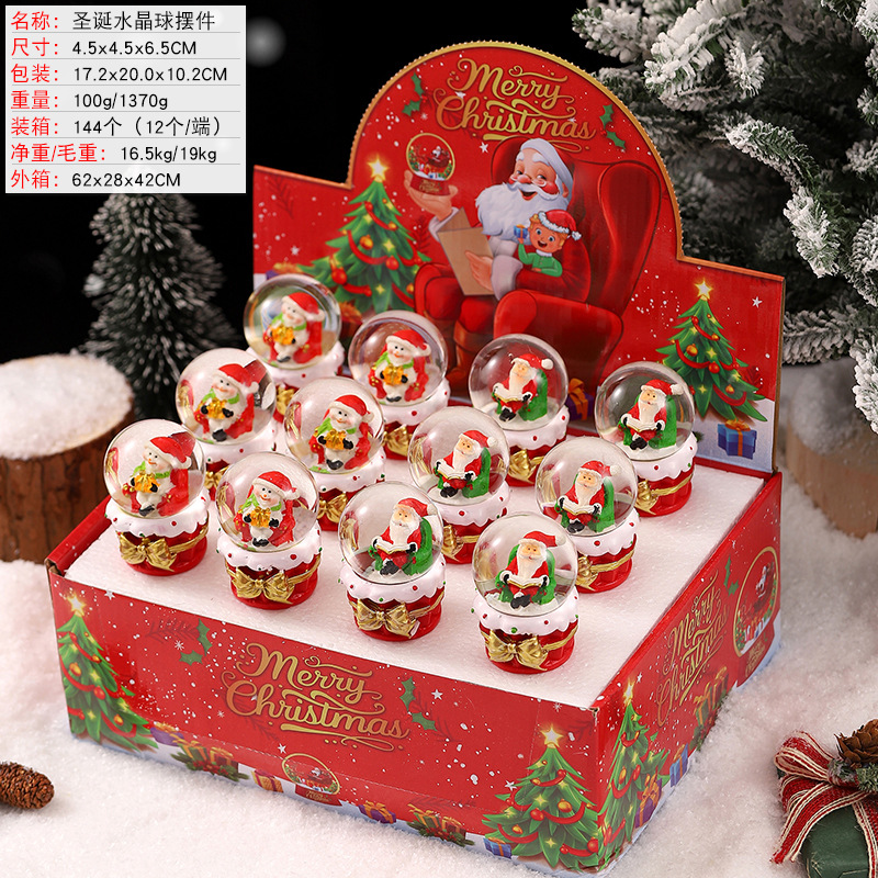 Una variedad de regalos de decoración de Navidad Navidad iluminante bola de cristal caja de música ventana diseño de velas lámparas de viento árbol de Navidad