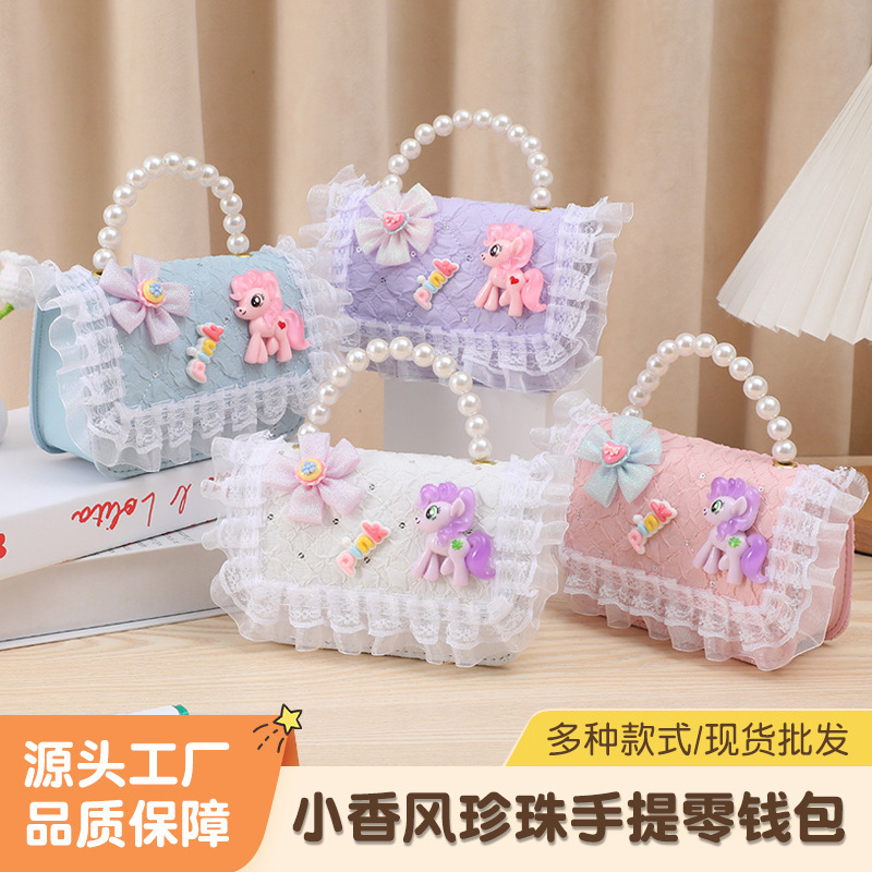 Cute divertido bolso para niños pequeño Xiangfeng perla monedero portátil pequeña princesa bolsa de almacenamiento bandolera estilo ins al por mayor