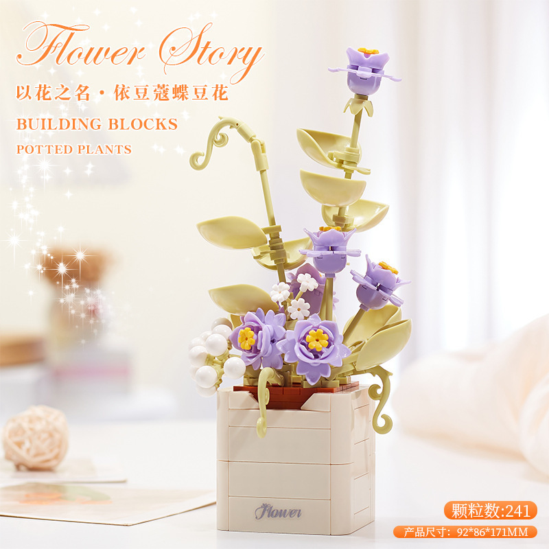 積み木の花がバラのオルゴールを飾っています。|undefined