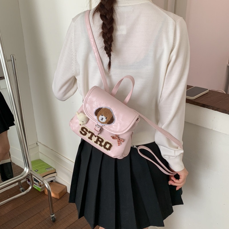 Tide retro nuevo 2026 cachorro nicho de dibujos animados femeninos, mochila coreana, mochila encantadora de moda para viajar