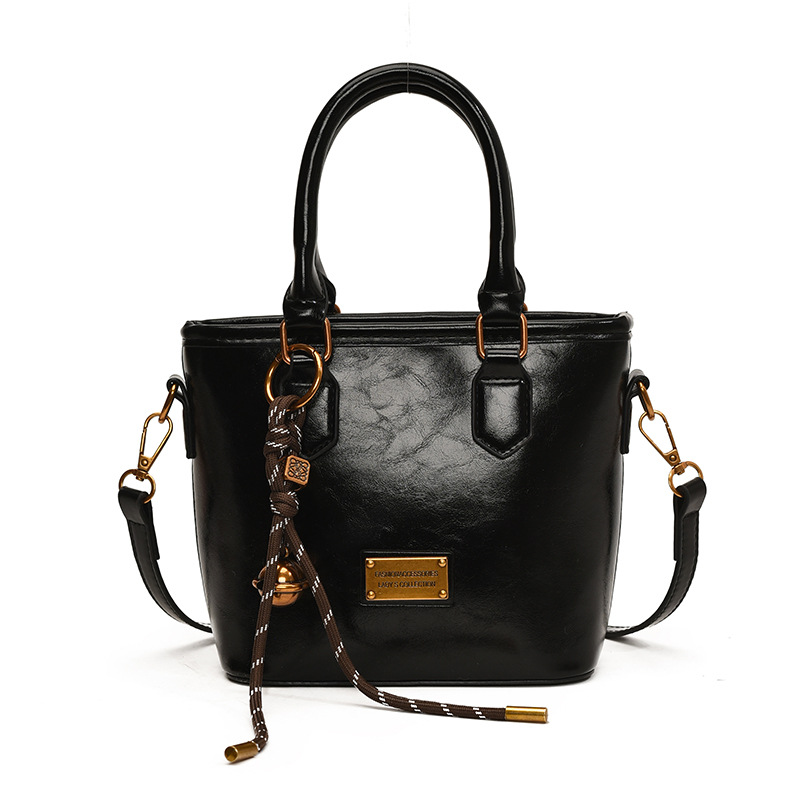 Retro versátil simple bolso de cubo portátil 2025 nuevo bolso de mujer nicho manuscrito de moda coreana bolso de hombro