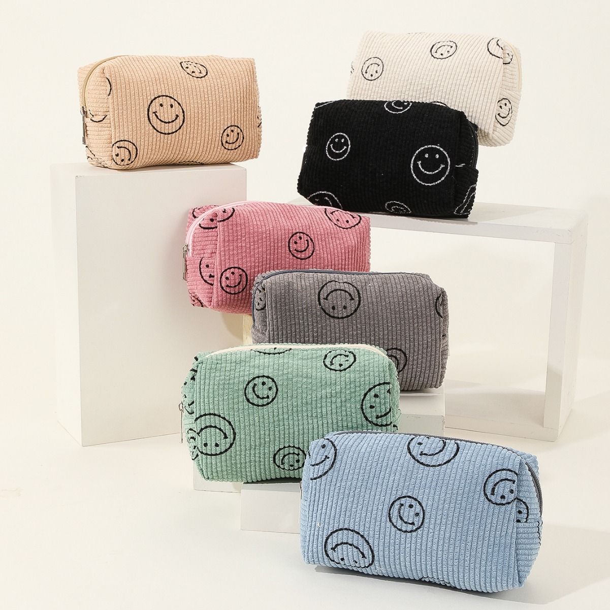 Cara sonriente de pana bolsa de cosméticos mediana bolsa de lavado de almacenamiento de gran capacidad estilo universitario bolsa de sonrisa de almacenamiento de viaje transfronterizo