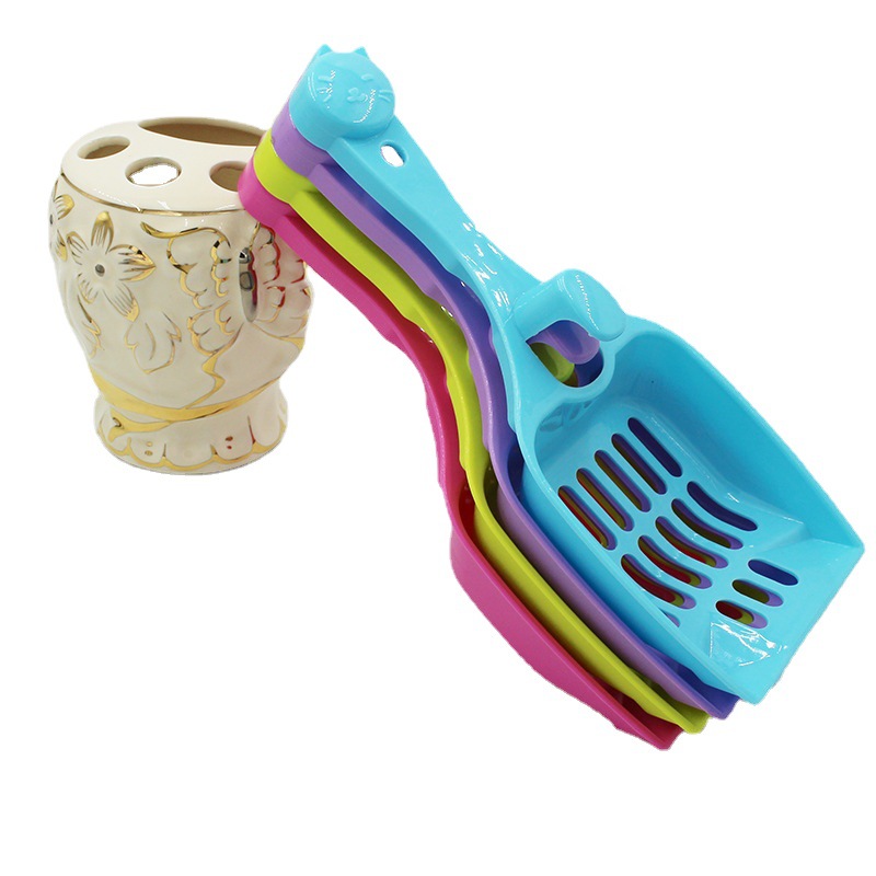 Venta al por mayor mascota gato arena pala caramelo color gato cabeza gato pala gato mierda pala estiércol hueco de plástico alimentos pala suministros