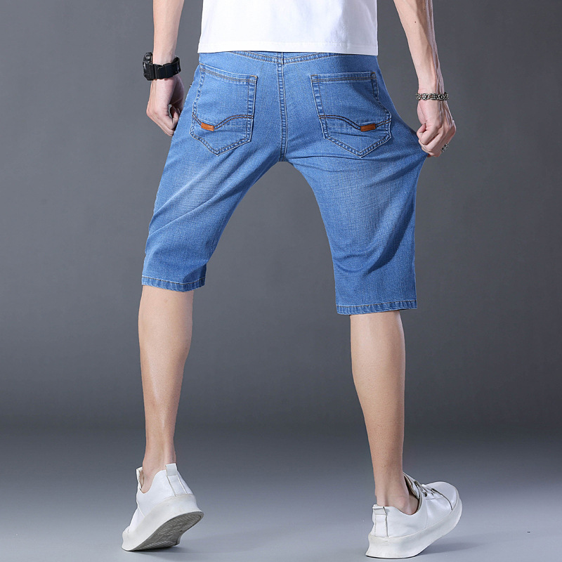 夏の薄いタイプの7分のズボンの男性のまっすぐな筒の紳士服のデニムのショートパンツの弾力性は夏の青年の中でズボンを修理します。|undefined