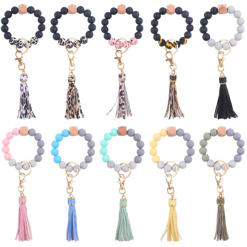 Nuevo cuero creativo pu corto borla colgante de silicona con cuentas muñeca llavero colgante pulsera llavero Accesorios