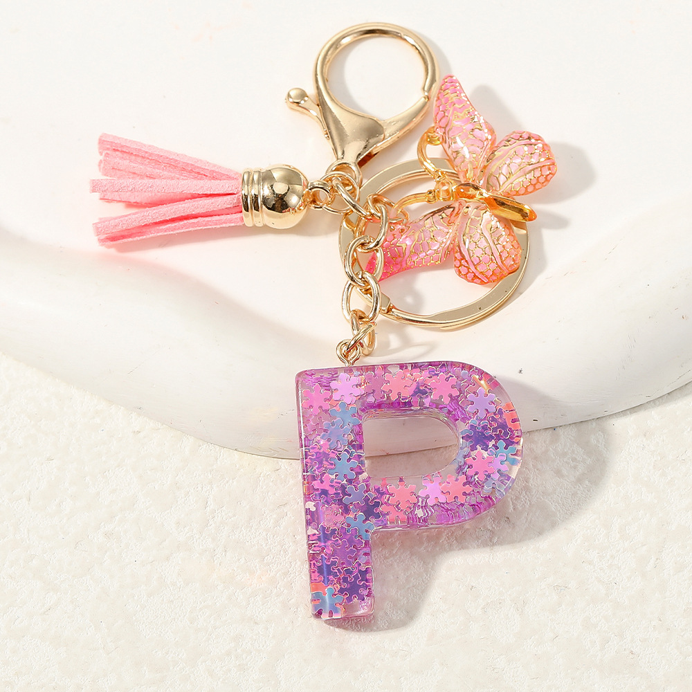 Nuevo color púrpura claro mezcla de polvo brillante letras inglesas resina llave colgante estilo simple mariposa borda colgante