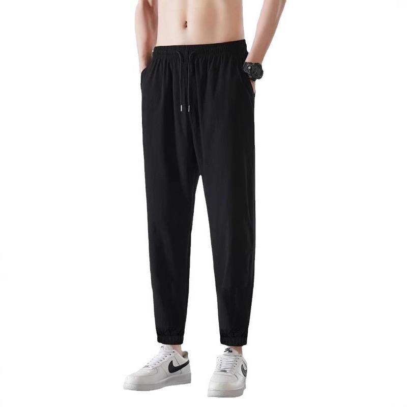 Marca de marea impermeable a prueba de viento, pantalones casuales deportivos al aire libre para hombres y mujeres, pantalones de secado rápido para parejas