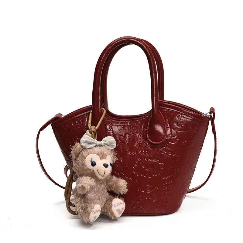 Nicho coreano bolsas de cesta de verduras de mano primavera de mujeres 2025 nueva moda encantadora bolsa en relieve bolsas de mochila