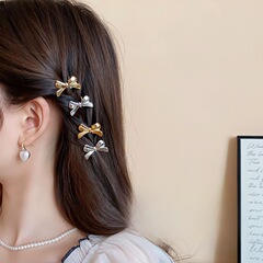 ミニの小さいサイズの甘いクールな蝶結びのヘアピンの額は前髪の前髪を砕きます。