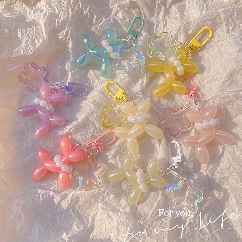 Pequeño Libro Rojo mismo lindo jalea globo láser perro llavero colgante colorido cachorro de dibujos animados teléfono llavero