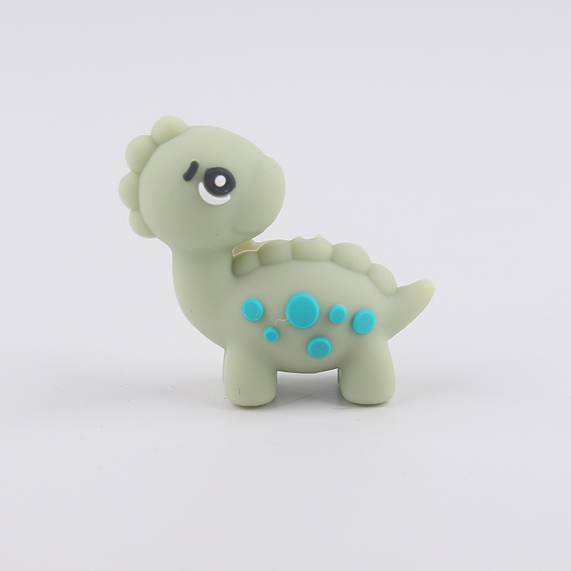 Dibujos animados Dinosaur Dental Topeador Cuentas de goteo Bolígrafo de cuentas de bricolaje Pezones para bebés Cadena anti-caída Amazon