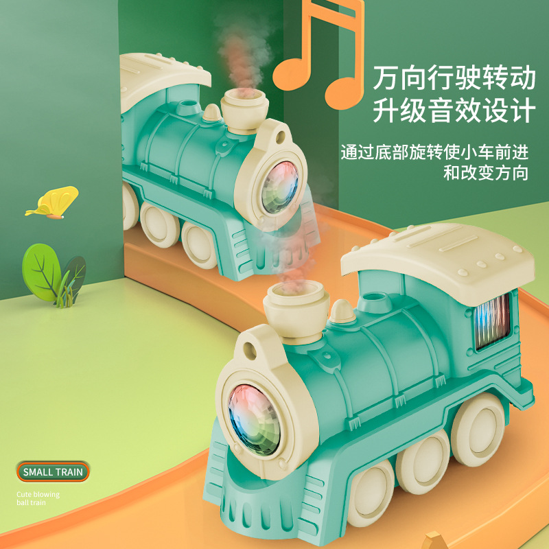 Niños suspendidos soplando bola tren iluminado concierto spray multifuncional tren pequeño juguetes eléctricos al por mayor cruce