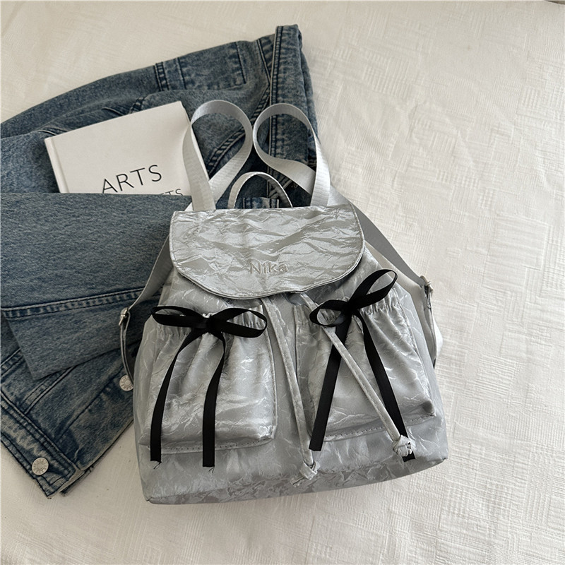 Mochila de lazo de sentido de alta gama para mujer 2025 nueva moda mochila de viaje mochila escolar casual para estudiantes coreanos