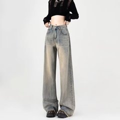 アメリカのレトロなストレートの高腰のジーパンの女性の街頭の潮は掛けてゆったりしていてやせているギャルの毛の辺の広い足はズボンを引きずっています。