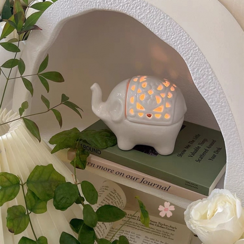 White candle, bookcase, atmospheric diffuser, french style, elephant
