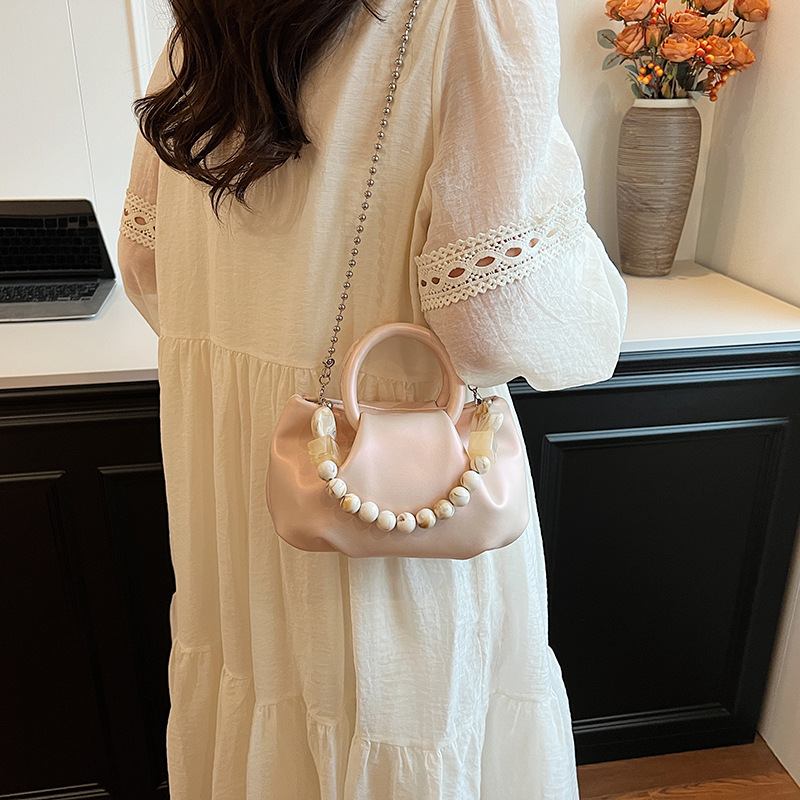 High end handbag for women in 2024, new niche design, summer handheld pleated chain strap, crossbody cloud bag_voghion.com
