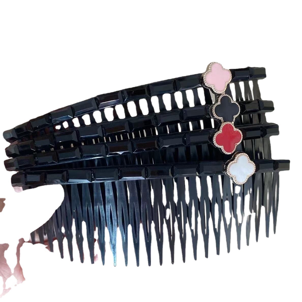 Peine de pelo de estilo coreano peine de inserción al por mayor simple Flor de cuatro pétalos flequillos roto artefacto trébol de cuatro hojas insertar peine clip lateral Cabeza trasera