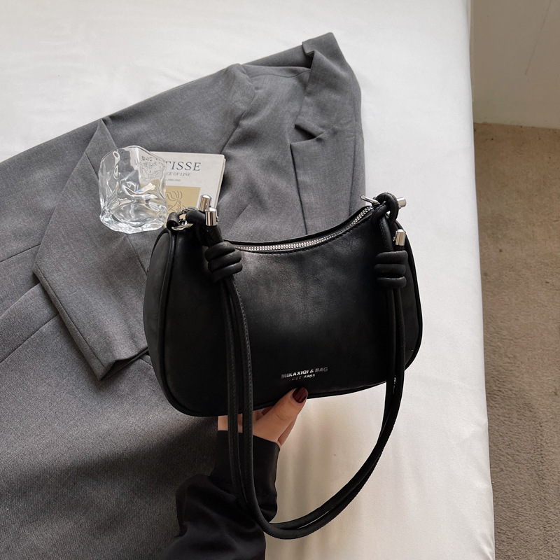 Bolsa de brazo de moda retro para mujeres 2026 primavera nueva simple diaria bolsa de bolsas de bolsillo de alto valor coreano hombro único