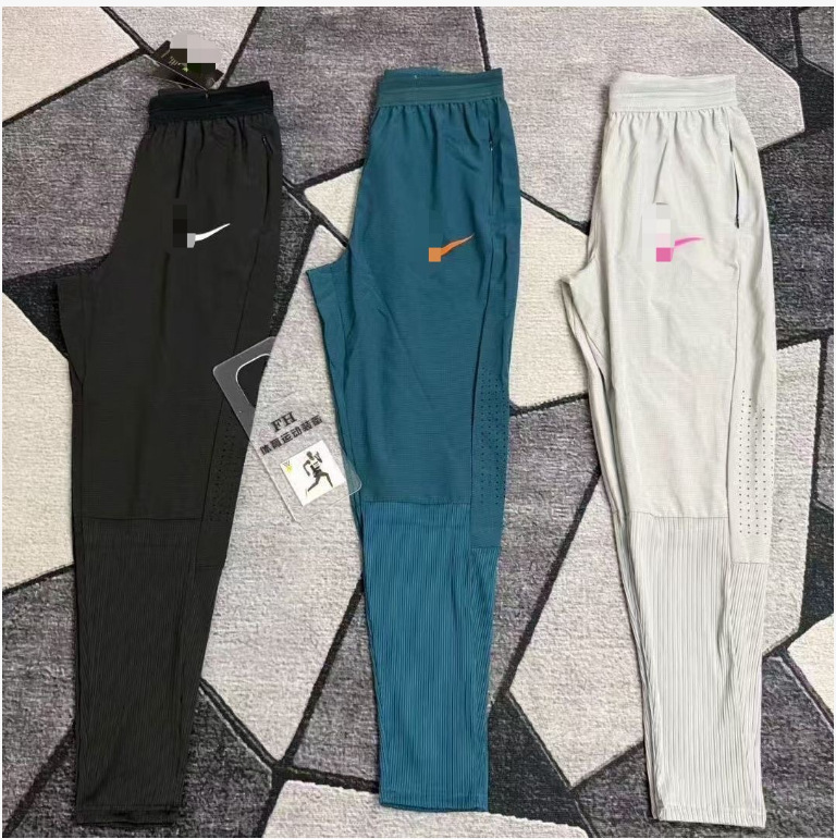 Popular Foreign Trade Item: Quick-Dry Athletic Training Running Pants for Men and Women, Breathable Ribbed Zipper Sports Pants Popular Foreign Trade Item: Quick-Dry Athletic Training Running Pants for Men and Women, Breathable Ribbed Zipper Sports Pants