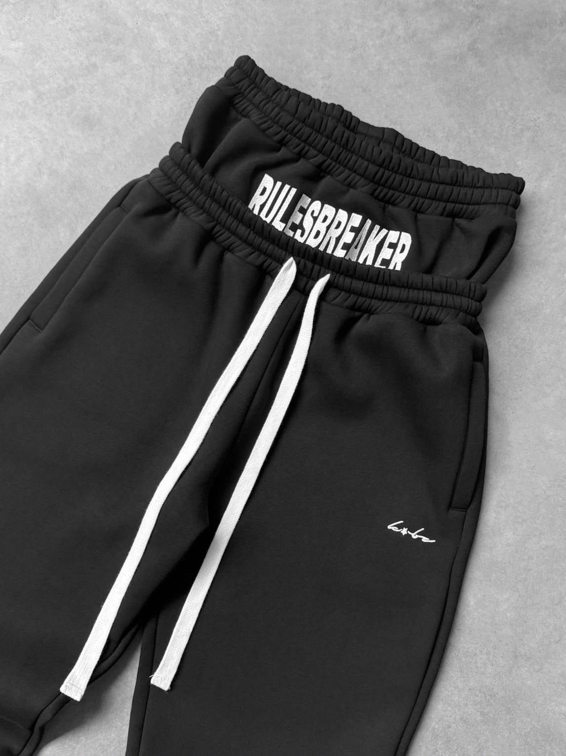 2025 Europa y América Cross-border street hip-hop holgados pantalones casuales rectos pantalones con cremallera pantalones de cintura doble falsos de dos piezas