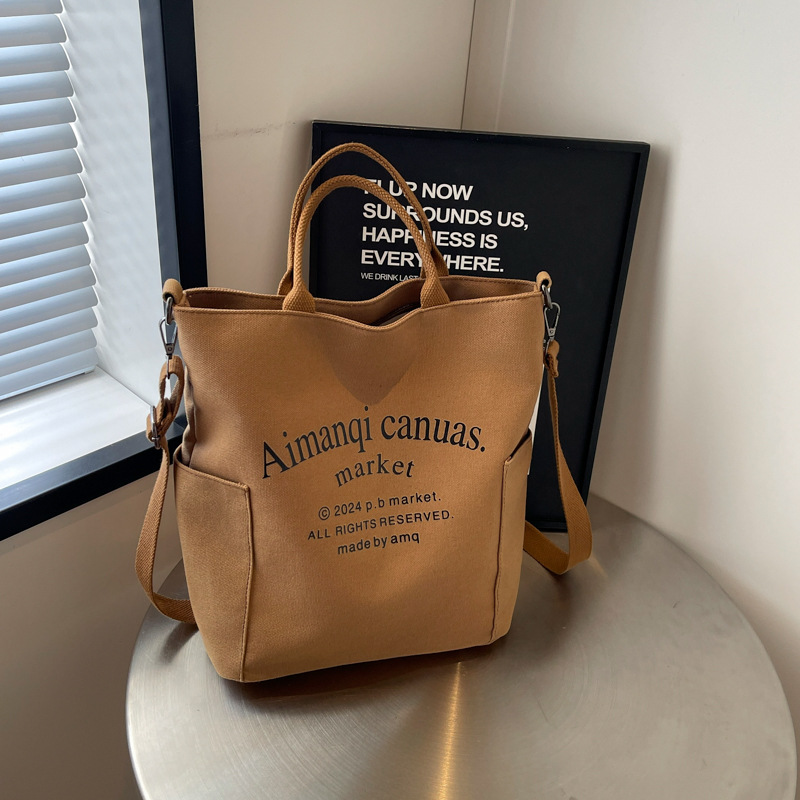 时尚印花字母大容量水桶包2024夏季新款个性休闲厚实斜跨单肩包包