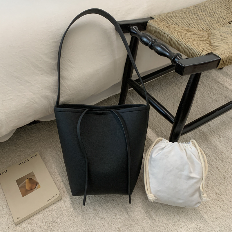 Bolsa de cubo de viaje coreano para mujeres 2025 nuevo estilo de alta calidad, bolso de hombro de cuero suave de gran capacidad, bolso de madre