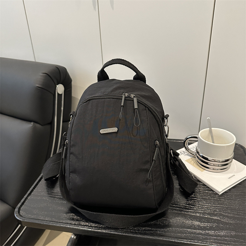 Mochila de verano nueva mochila de viaje de viaje de gran capacidad bolso de hombro de moda todo-fósforo femenino ligero