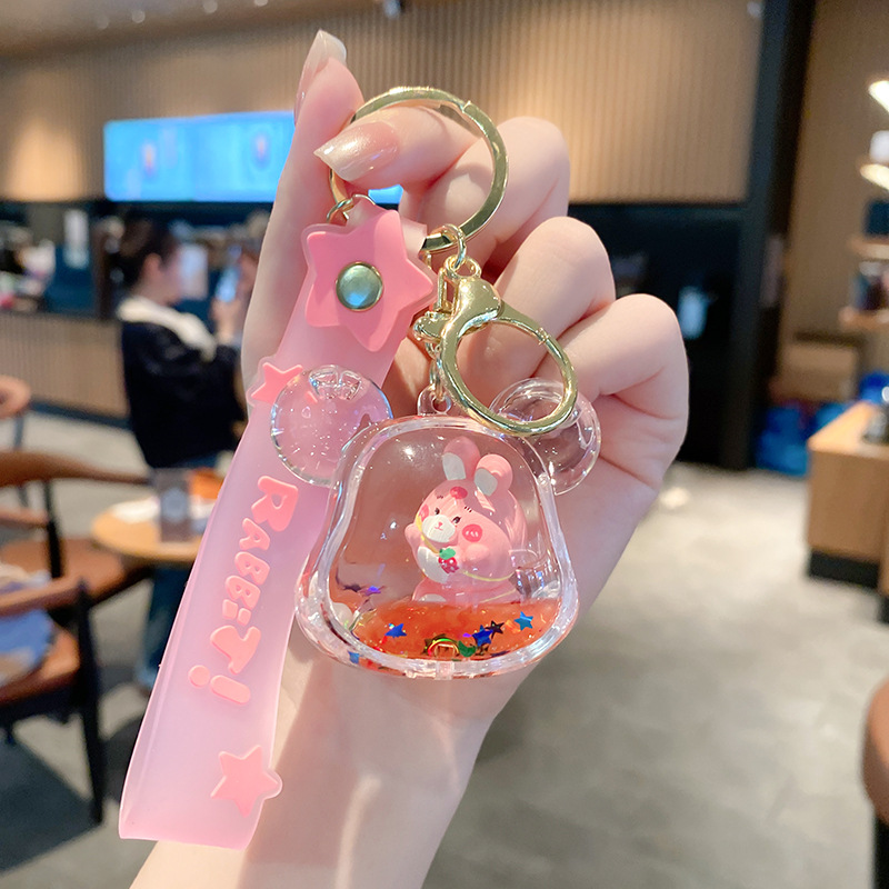 Linda bolsa de fresa de aceite llavero de conejo exquisito colgante de botella de deriva colgante de bolsa de coche colgante pequeño regalo al por mayor