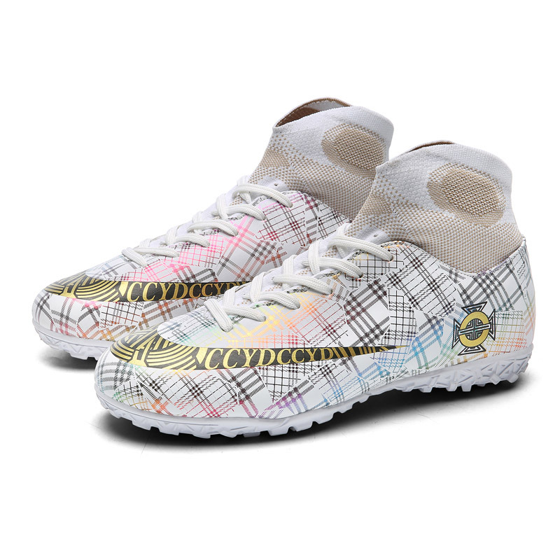 Venta al por mayor zapatos de fútbol resistente al desgaste transpirable Pato Mandarín color alto-top antideslizante Plaid casual corto clavo hierba juventud entrenamiento zapatos