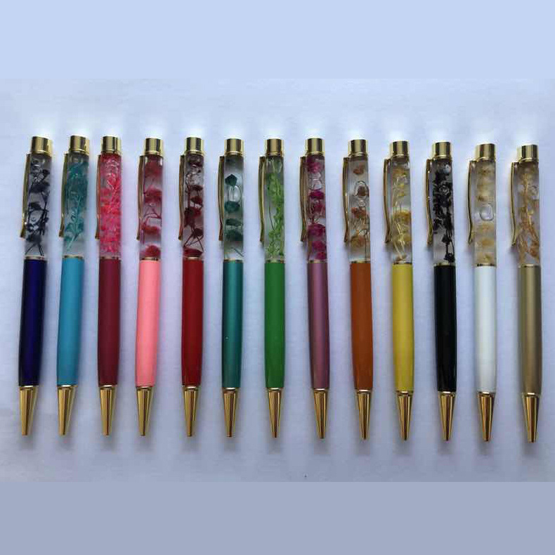 Suministro directo de fábrica flor seca bolígrafo pluma de aceite creativo DIY Bolígrafo De Metal logotipo personalizado pluma de aceite de flor seca