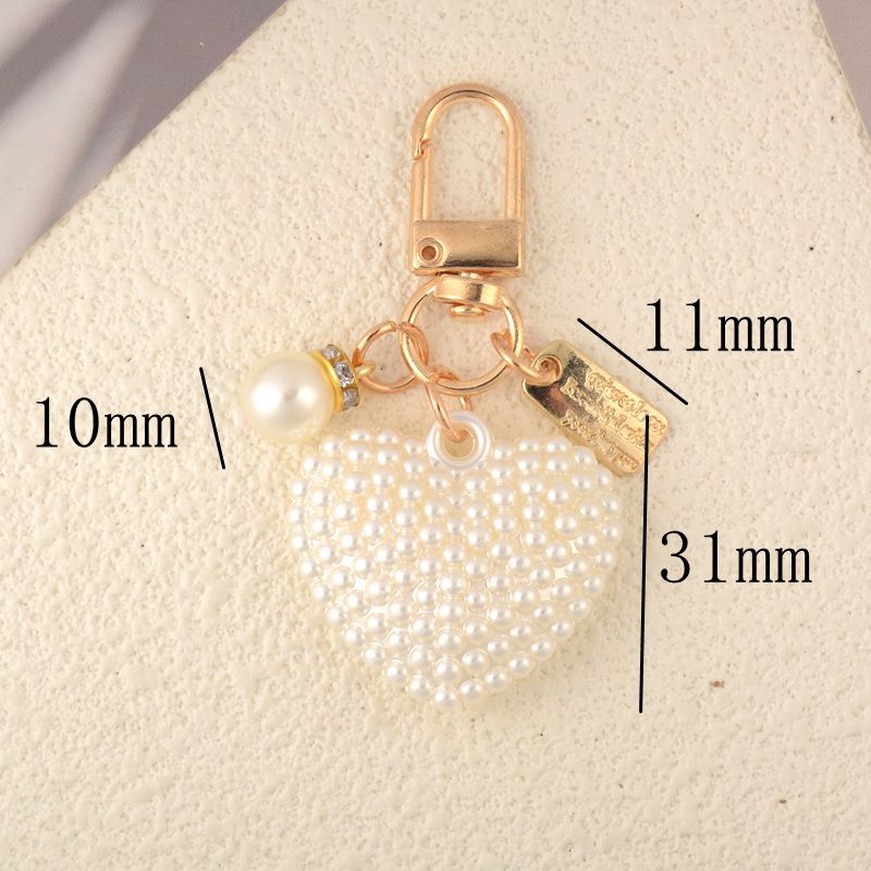 1200g Weight Bag Pendant, Keychain Classification Simple Style Classic Style Heart Shape Ball Zinc Alloy Unisex Bag Pendant Keychain